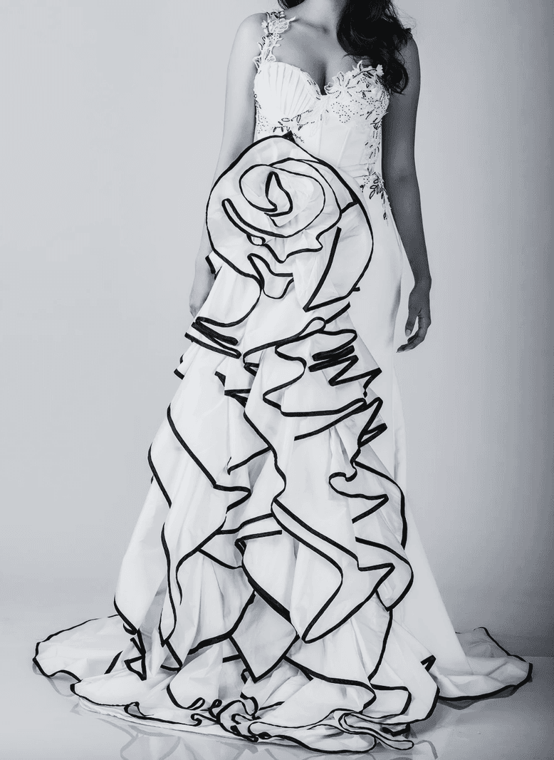 Lace mermaid wedding gown with ruffled tulle train